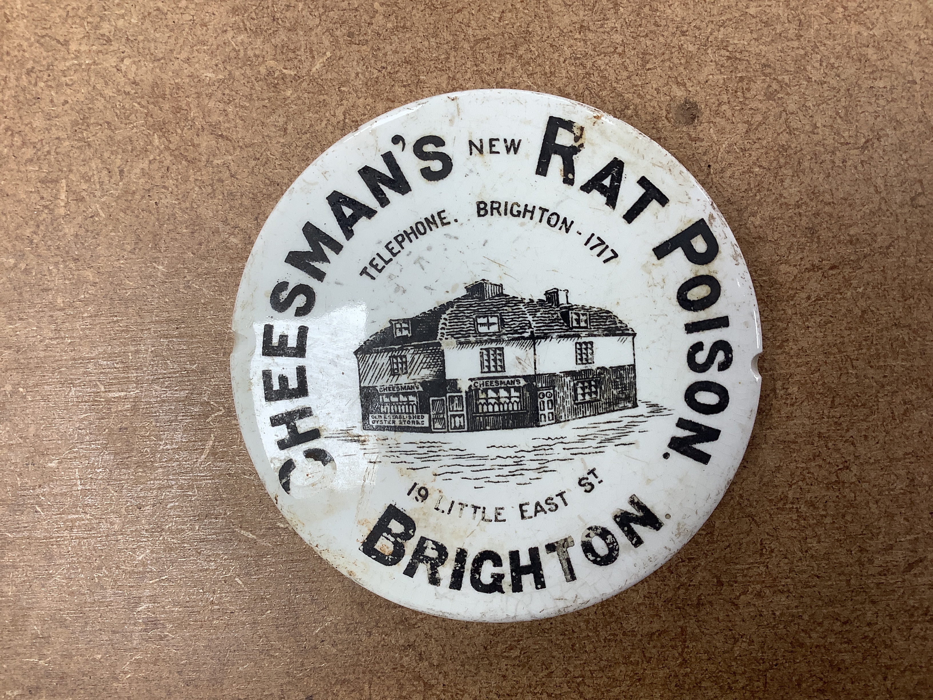 A large collection of anchovy paste toothpaste pot lids and pots together with a Brighton Cheesmans rat poison pot lid